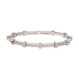 Front view of 18k white gold spring bracelet on white background with no model shown.