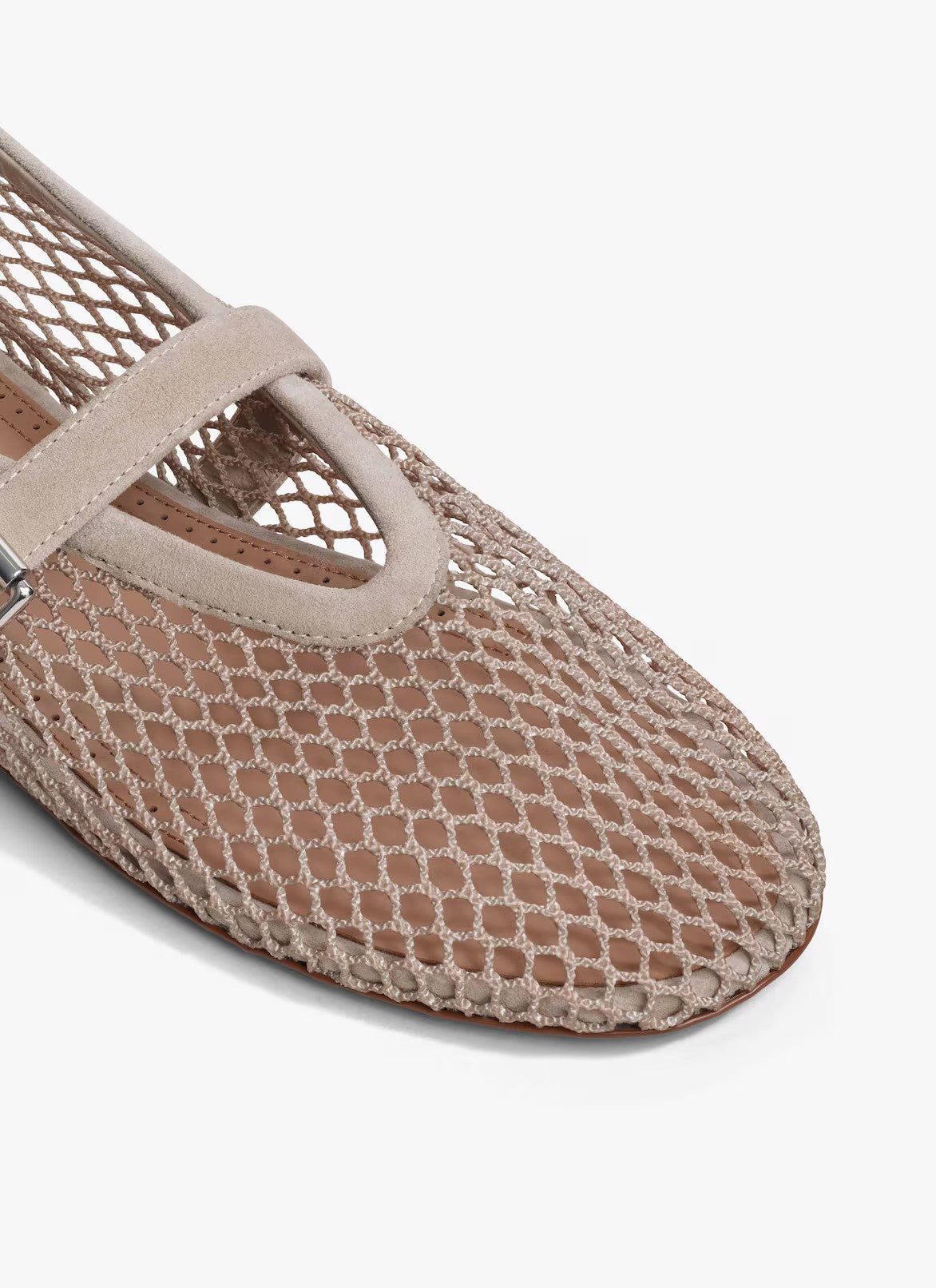Closeup side view of grey fishnet ballet flats on white background, with no model shown.