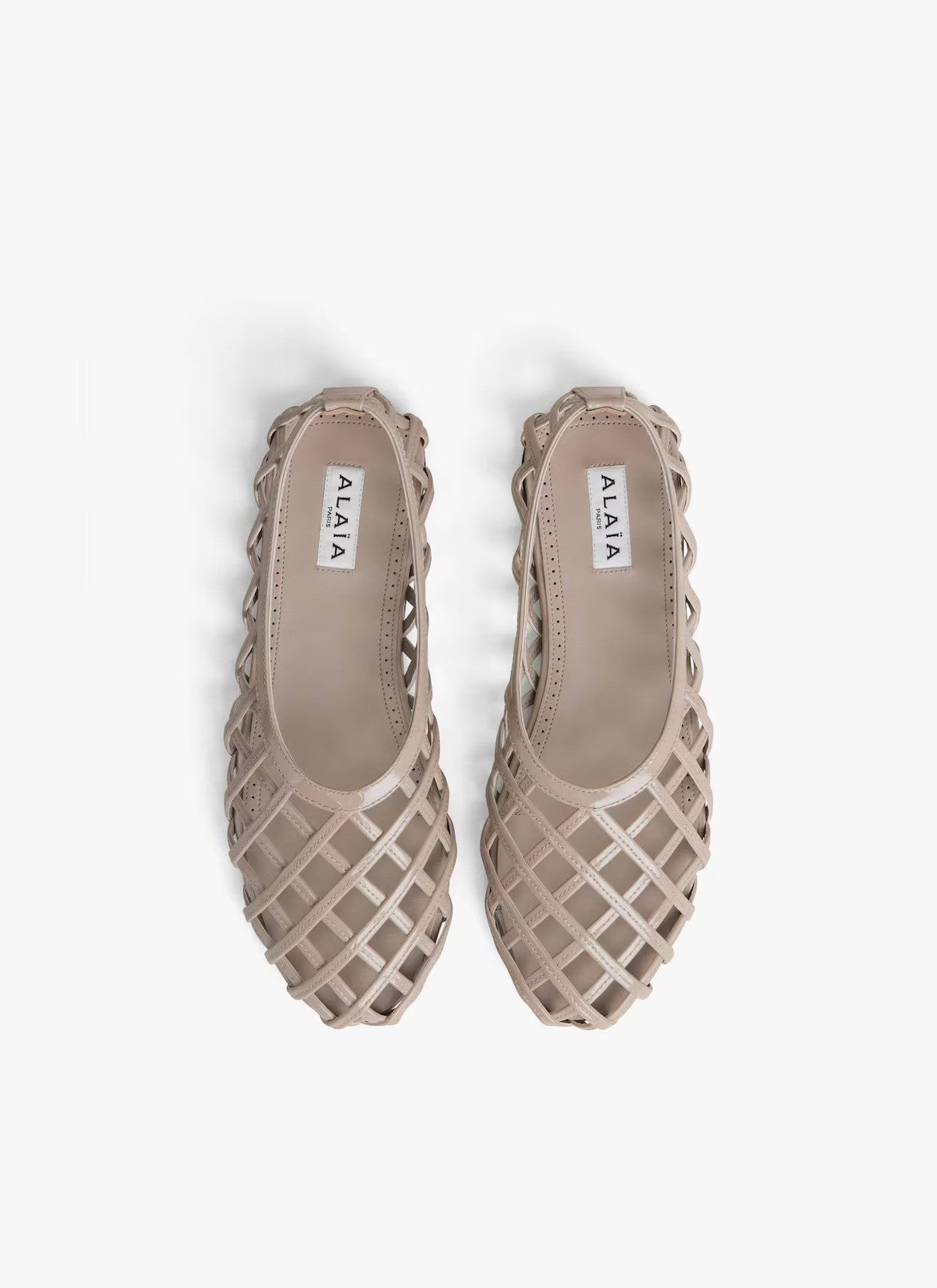 Overhead view of grey cage ballet flats on white background, with no model shown.