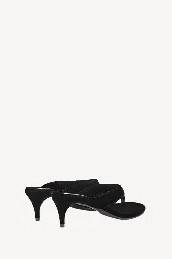 Pair view of noir heel thong mule in velvet on white background, with no model shown.