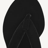 Overhead view of left heel thong mule in velvet on white background, with no model shown.