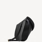 Side view of noir hip east west bag on white background, with no model shown.