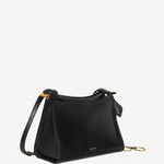 Side slanted view of noir le clicl small square bag on white background, with no model shown.