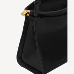 Open view of noir le click small square bag on white background, with no model shown.