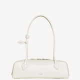 Front view of ivoire le teckel medium bag on white background, with no model shown.