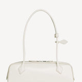 Back view of ivoire le teckel medium bag on white background, with no model shown.