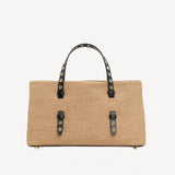 Front view of natural bag in straw on white background, with no model shown.
