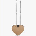 Front view of the natural heart bag in straw on a white background, with no model shown.