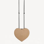 Back view of the natural heart bag in straw on white background, with no model shown