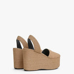 Back slanted view of natural wedge slingback in paper straw.