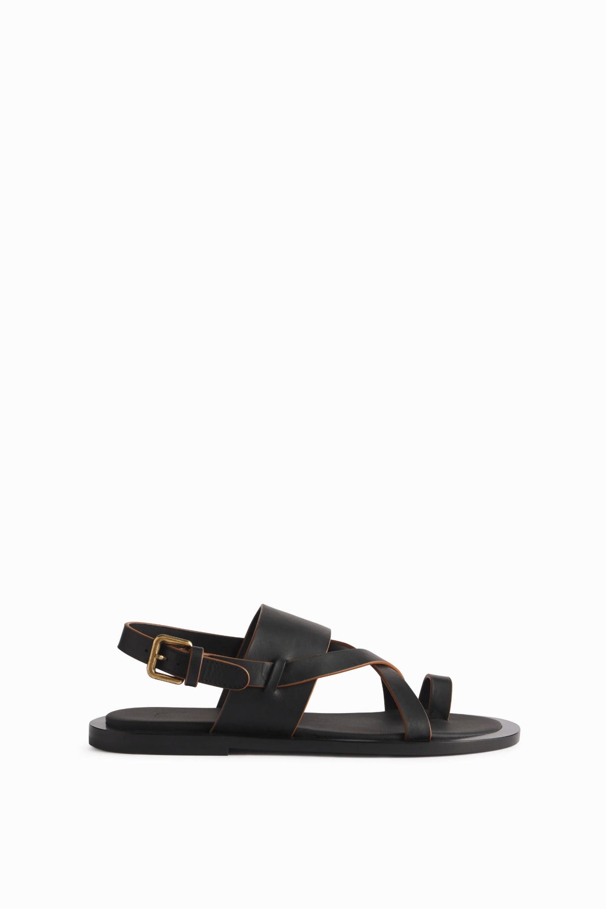 The left black leather sandal is shown in a side view profile with buckle shown in the back on white background.