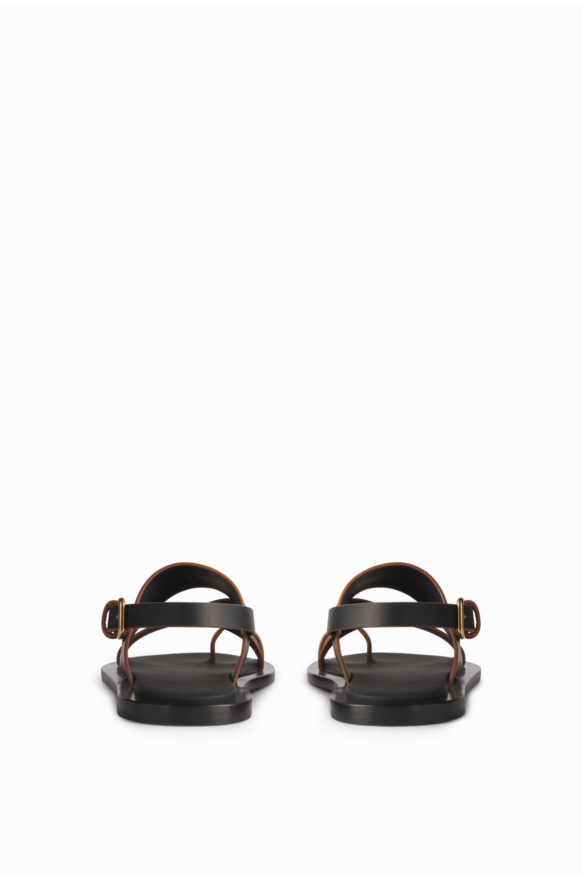 Both black leather sandals are shown with back of heel shown in foreground with white background.