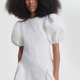 Front closeup view of bali dress on model, against a white background.