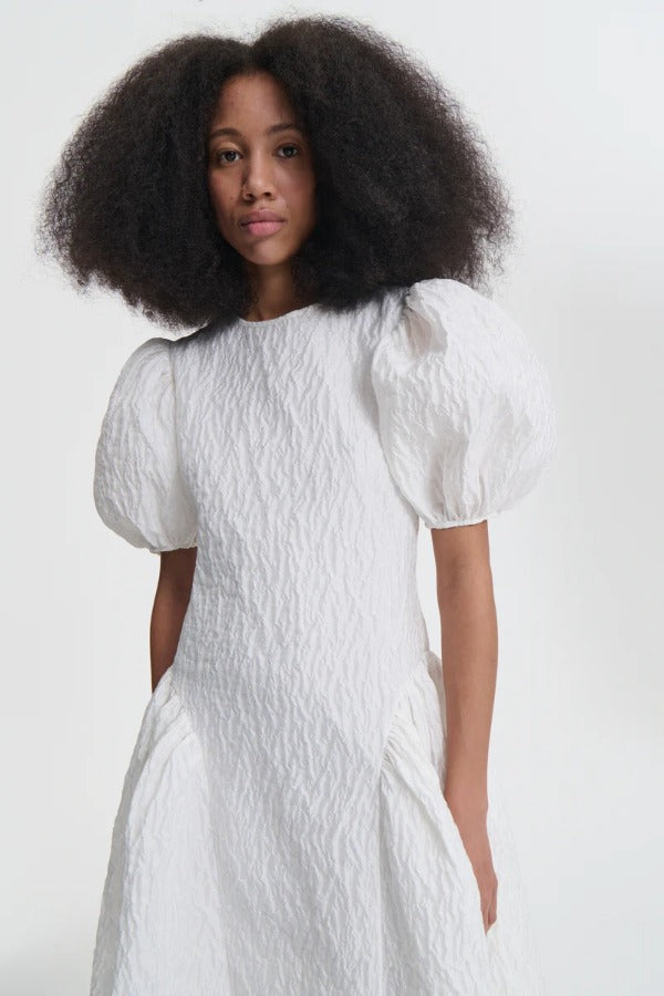 Front closeup view of bali dress on model, against a white background.