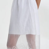 Front bottom hem closeup view on model, against a white background.