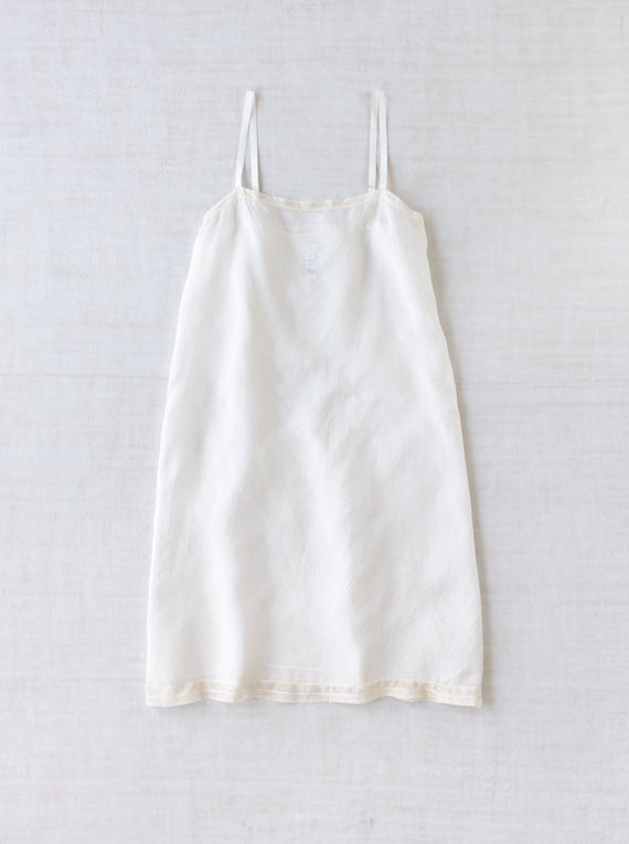 Front view of rice chemise slip on white background, with no model shown.