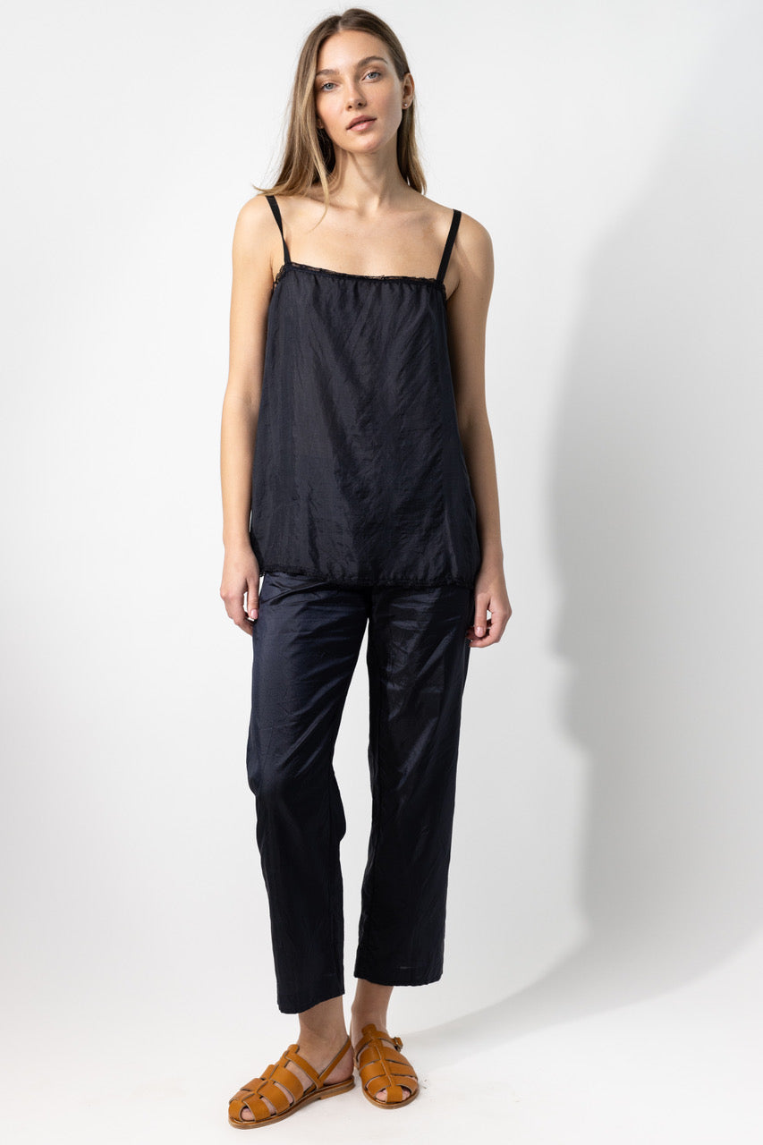 Front view of midnight short chemise on model wearing midnight pants and natural sandals, against a white background.