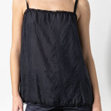 Front closeup view of midnight short chemise on model wearing midnight pants, against a white background.