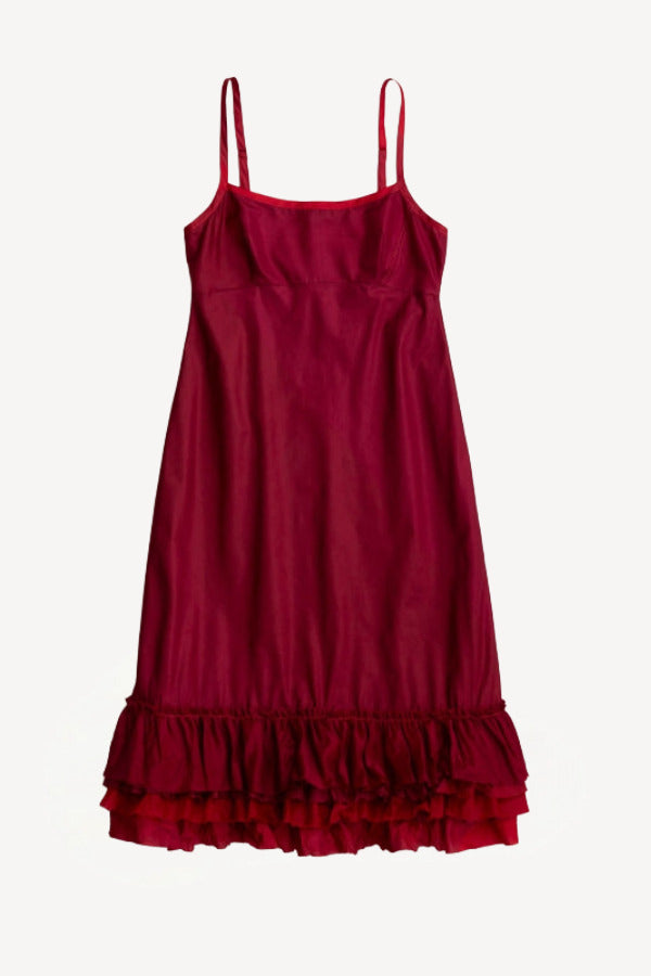Front view of tibet slip with ruffles on white background, with no model shown.
