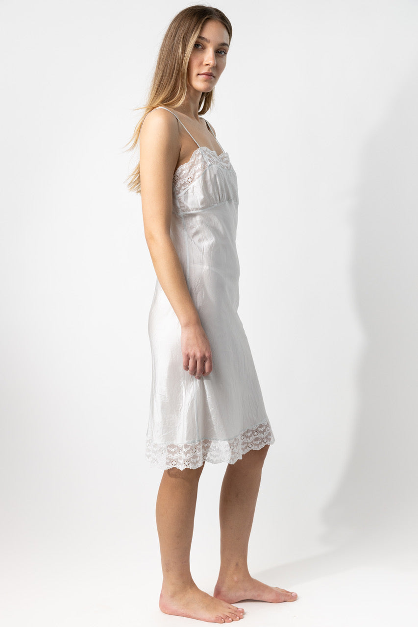 Alternate side closeup of tint susan slip on model, against a white background.