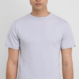 Front view of heaven cuba top on model wearing white pants, against a white background