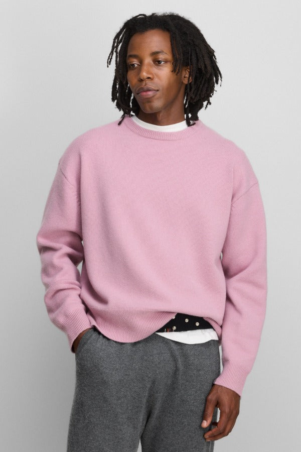 Front view of rosa no 431 mike sweater on model wearing grey pants, against a white background.