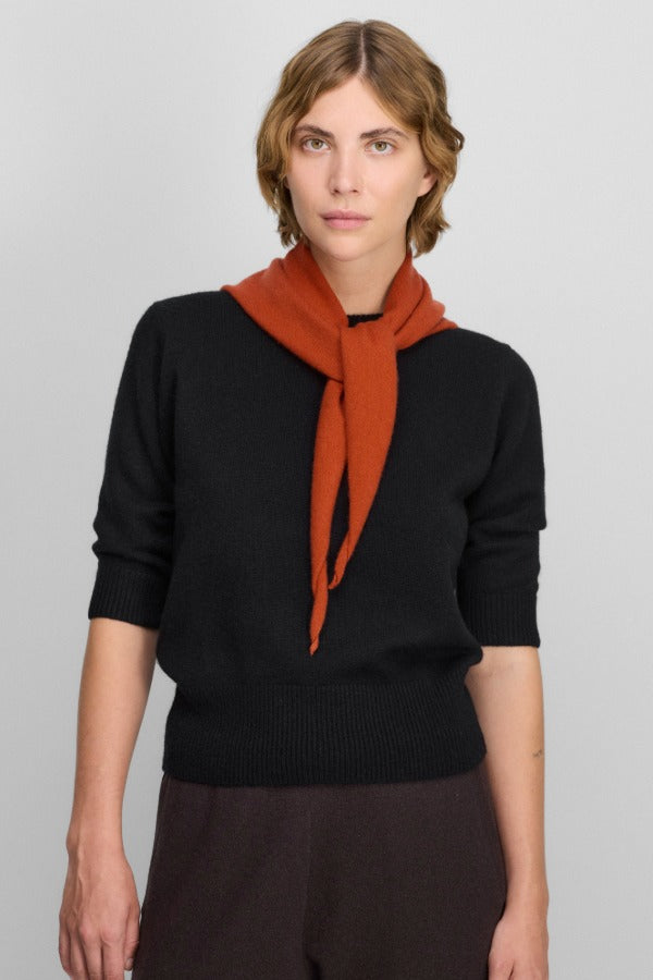 Front view of raven no 432 well lamb sweater on model wearing brown pants, against a white background.