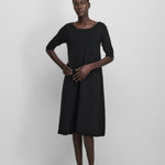 Front view of raven no 439 gina dress on model wearing black heels, against a white background.