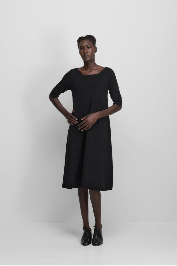 Front view of raven no 439 gina dress on model wearing black heels, against a white background.