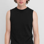 Front view of raven player top on model wearing white pants, against a white background.