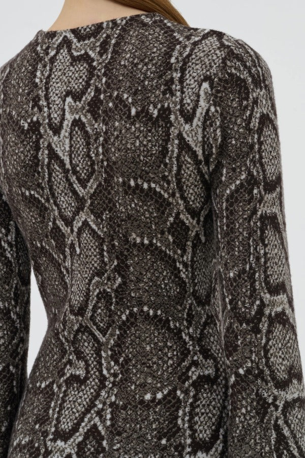 Back view of greyscale aalia dress on model, against a white background.