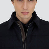 Front closeup view of blue men's jacket on model, against a white background.