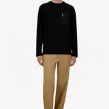 Front view of cammello laminar trousers on model wearing black t-shirt and sneakers, against a white background.