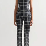 Front view of charcoal combo inna top on model wearing charcoal combo louis pants and flats, against a white background.