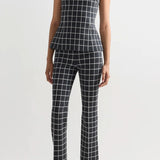 Alternate front view of charcoal combo inna top on model wearing charcoal combo louis pants and flats, against a white background.