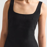 Front closeup view of black combo windowpane inna top on model, against a white background.