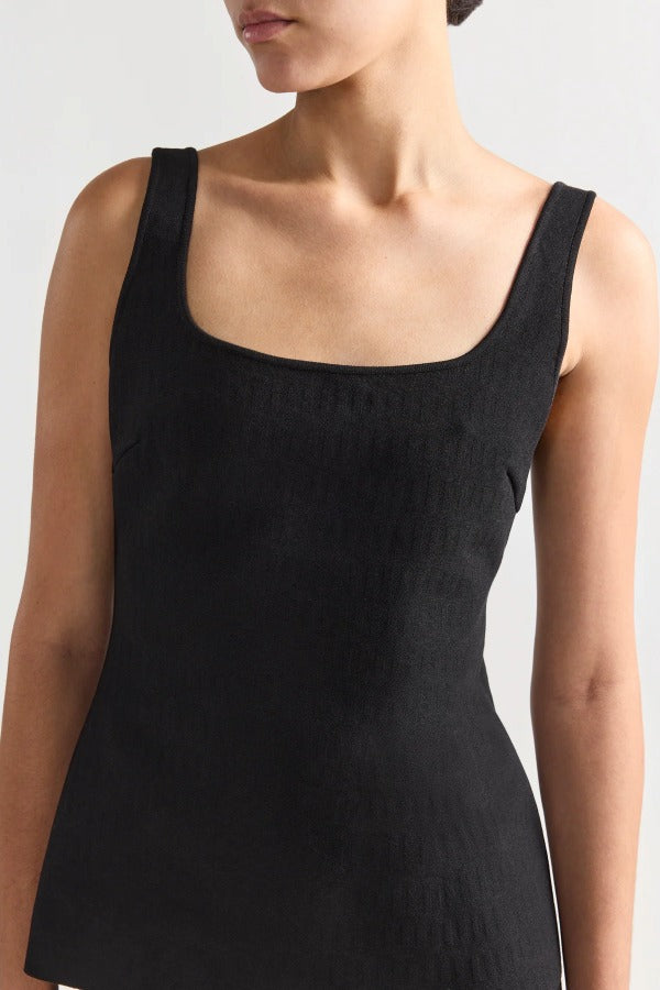Front closeup view of black combo windowpane inna top on model, against a white background.