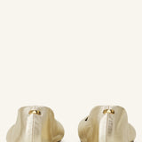 Back view of gold ballerina flats on white background, with no model shown.