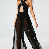 Front view of black wide leg pants on brown-haired model wearing black swim suit, against a white background.