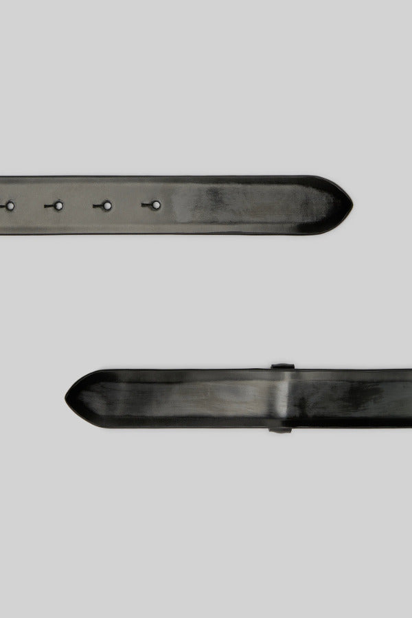 Closeup alternate view of black marsell men's contorno belt on white background, with no model shown.