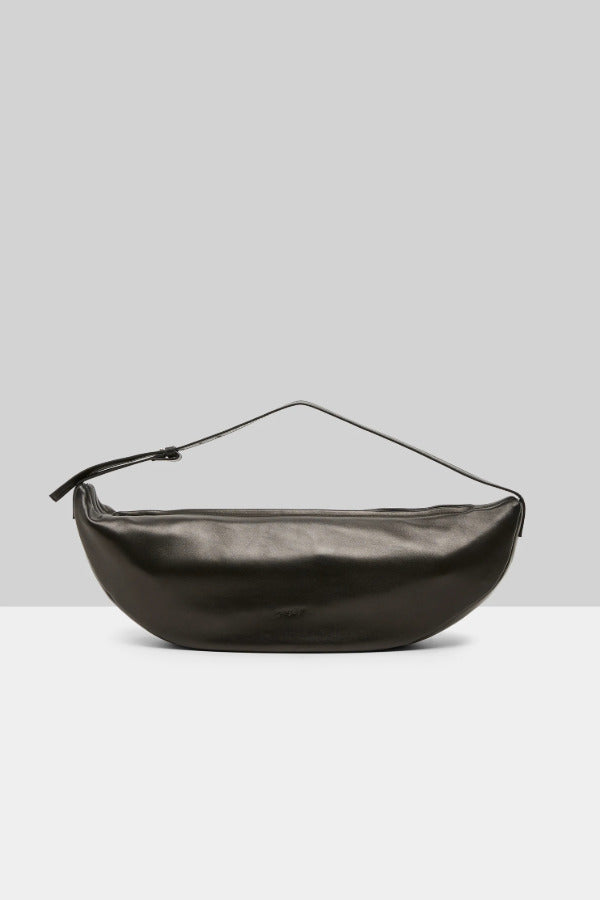 Back view of black marsell volta shoulder bag on white background, with no model shown.
