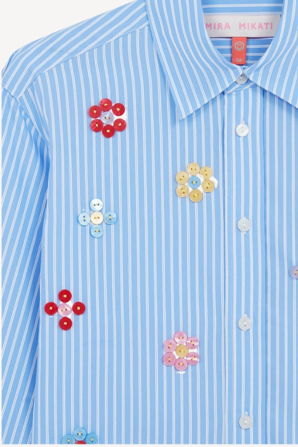 Front closeup view of blue/white button embroidered cropped shirt on white background, with no model shown.