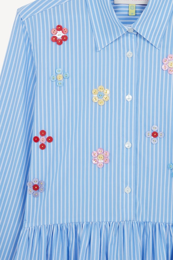 Front closeup of blue and white button embroidered ls shirt dress on white background, with no model shown.
