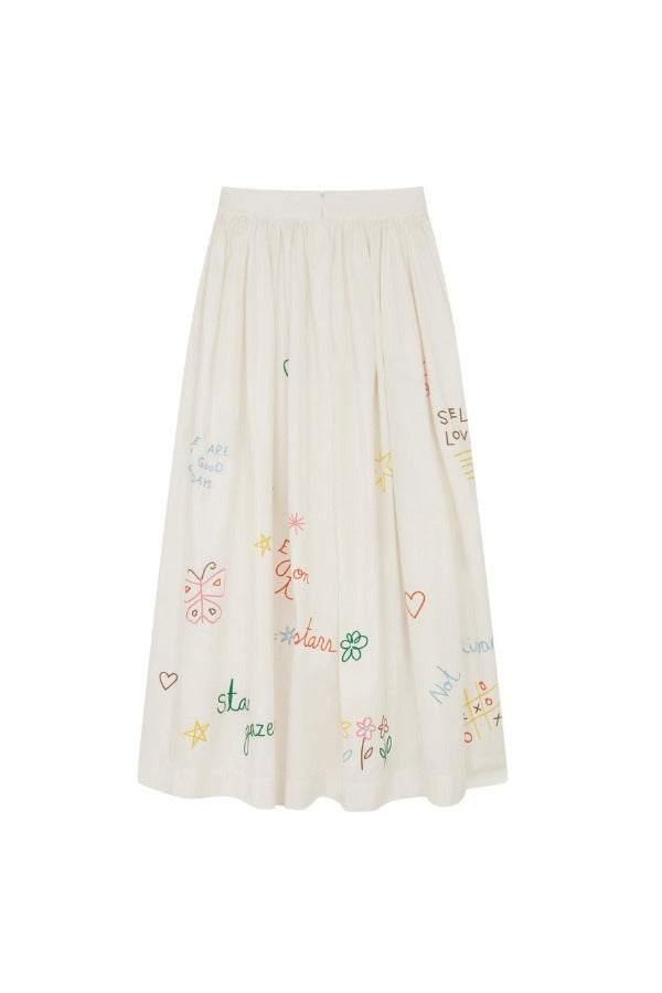 Back view of white embroidered scribble skirt on white background, with no model shown.