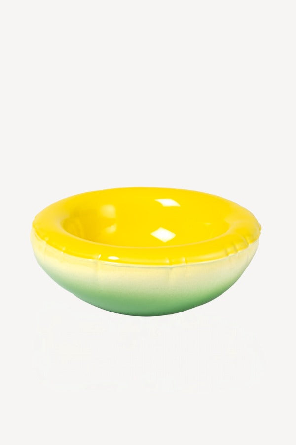 Front view of yellow hand sprayed ombre bowl on white background, with no model shown.