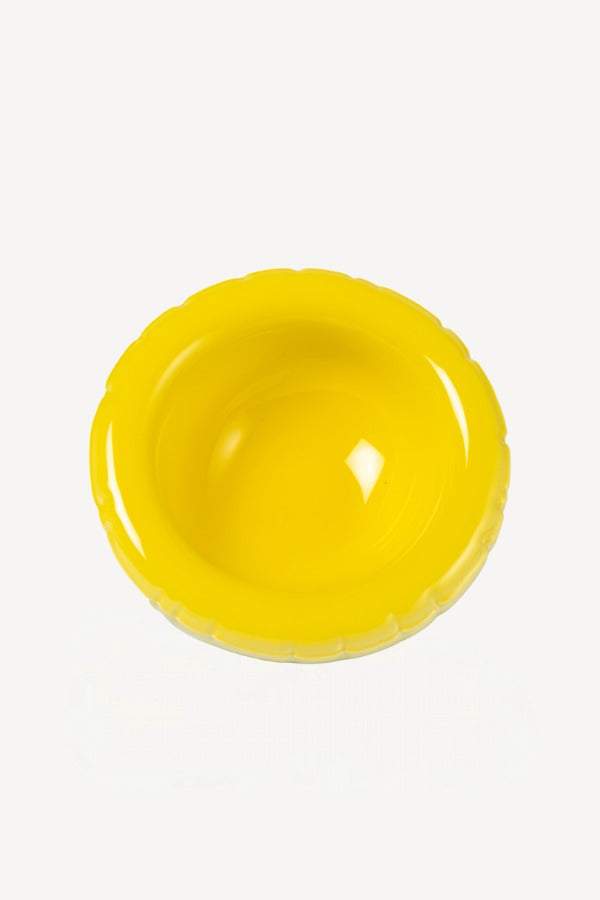 Overhead view of yellow hand sprayed ombre bowl on white background, with no model shown.