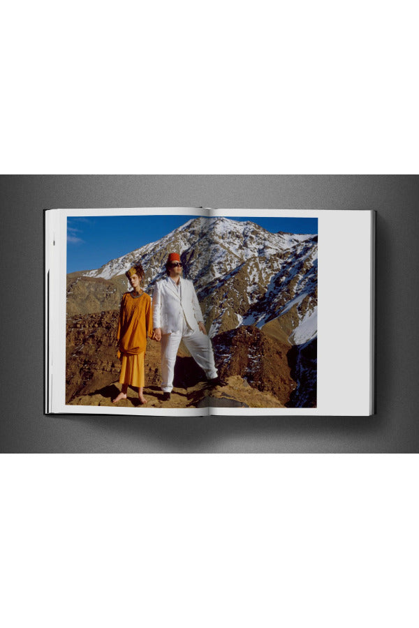 Open view of taschen david bailey eighties book on charcoal background.