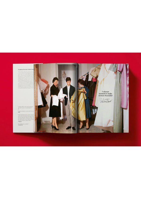 Open book view of taschen valentino book on red background.