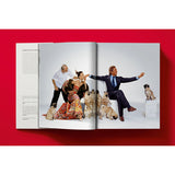 Open book view of taschen valentino book on red background.