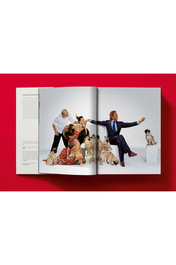 Open book view of taschen valentino book on red background.